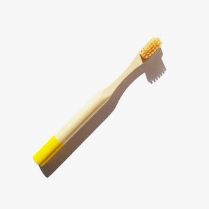 Solid Oral Care Premium Bamboo Child Toothbrush in yellow. Shop Zero Waste NZ.